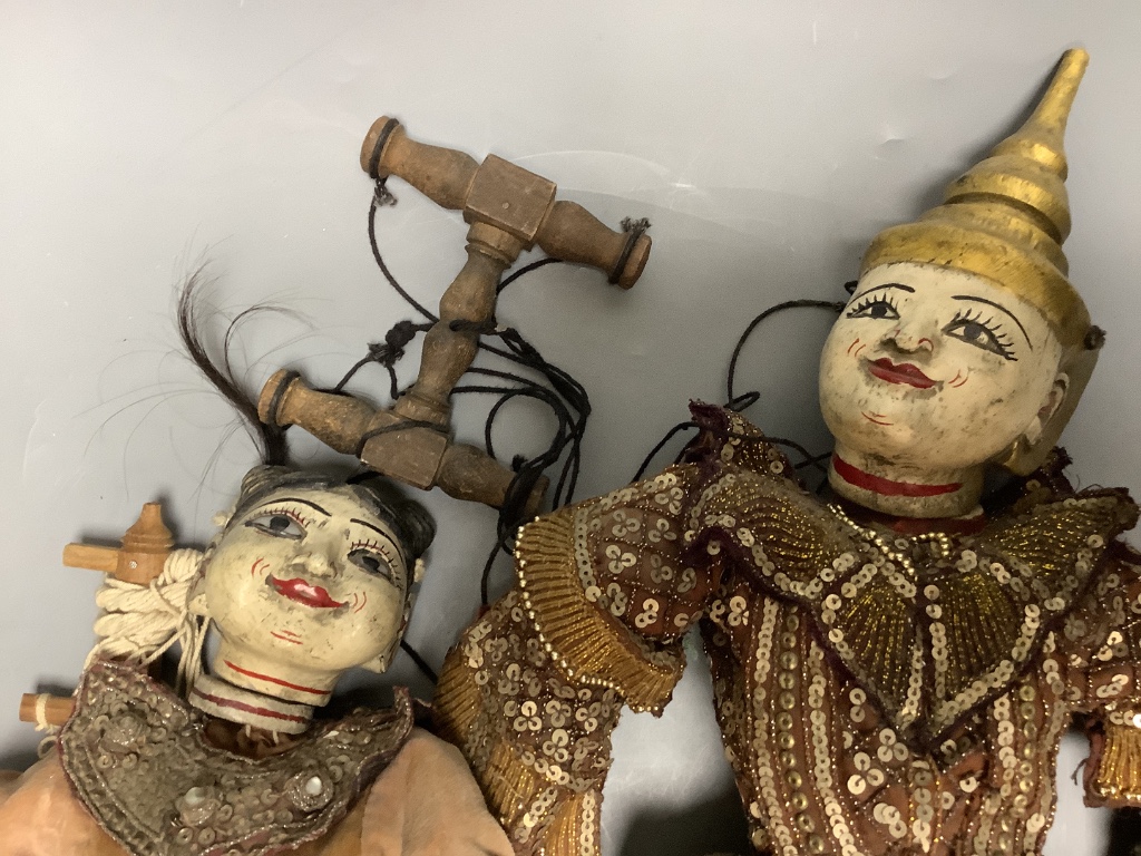 Two Burmese puppets, tallest 60cm